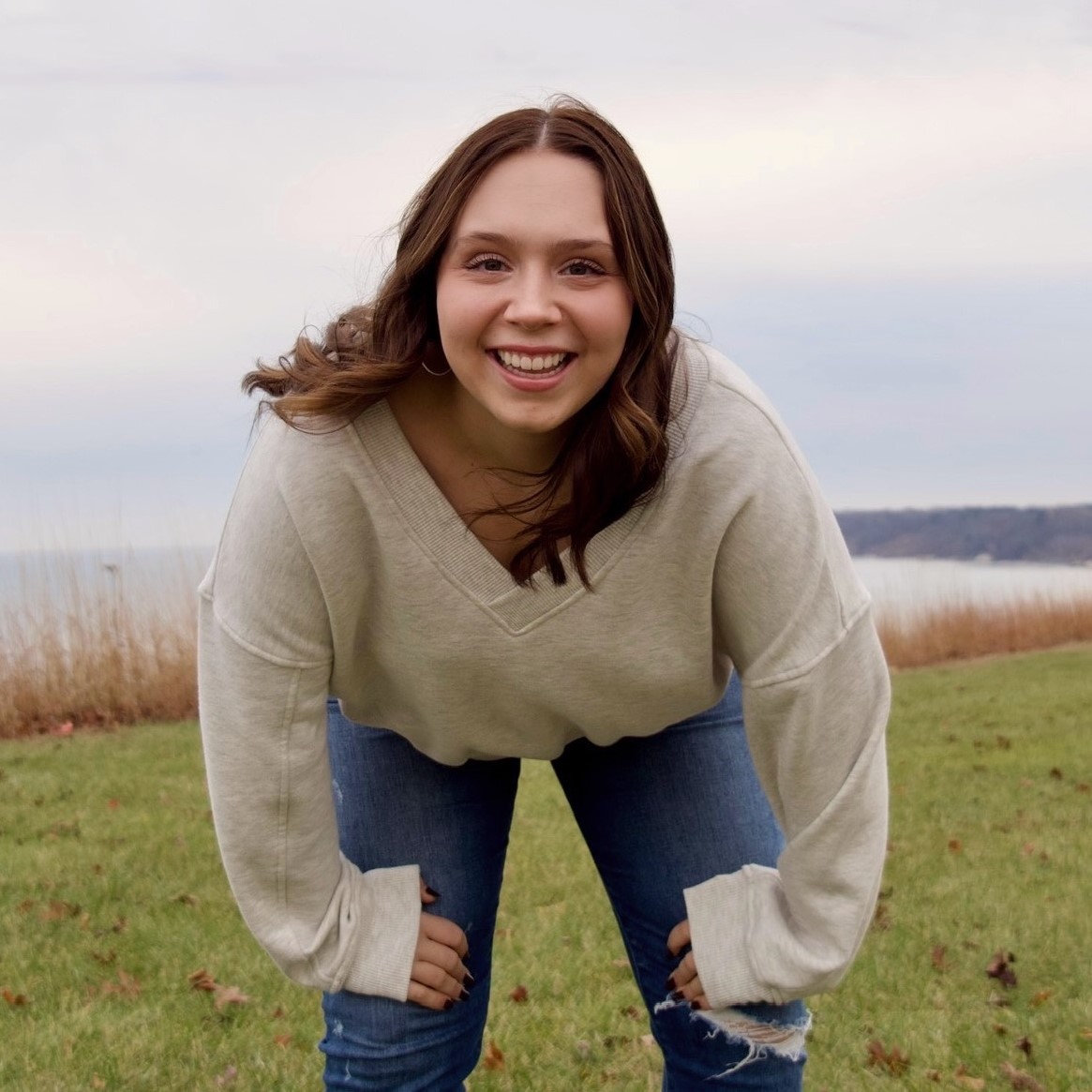 short brown hair girl with sweater