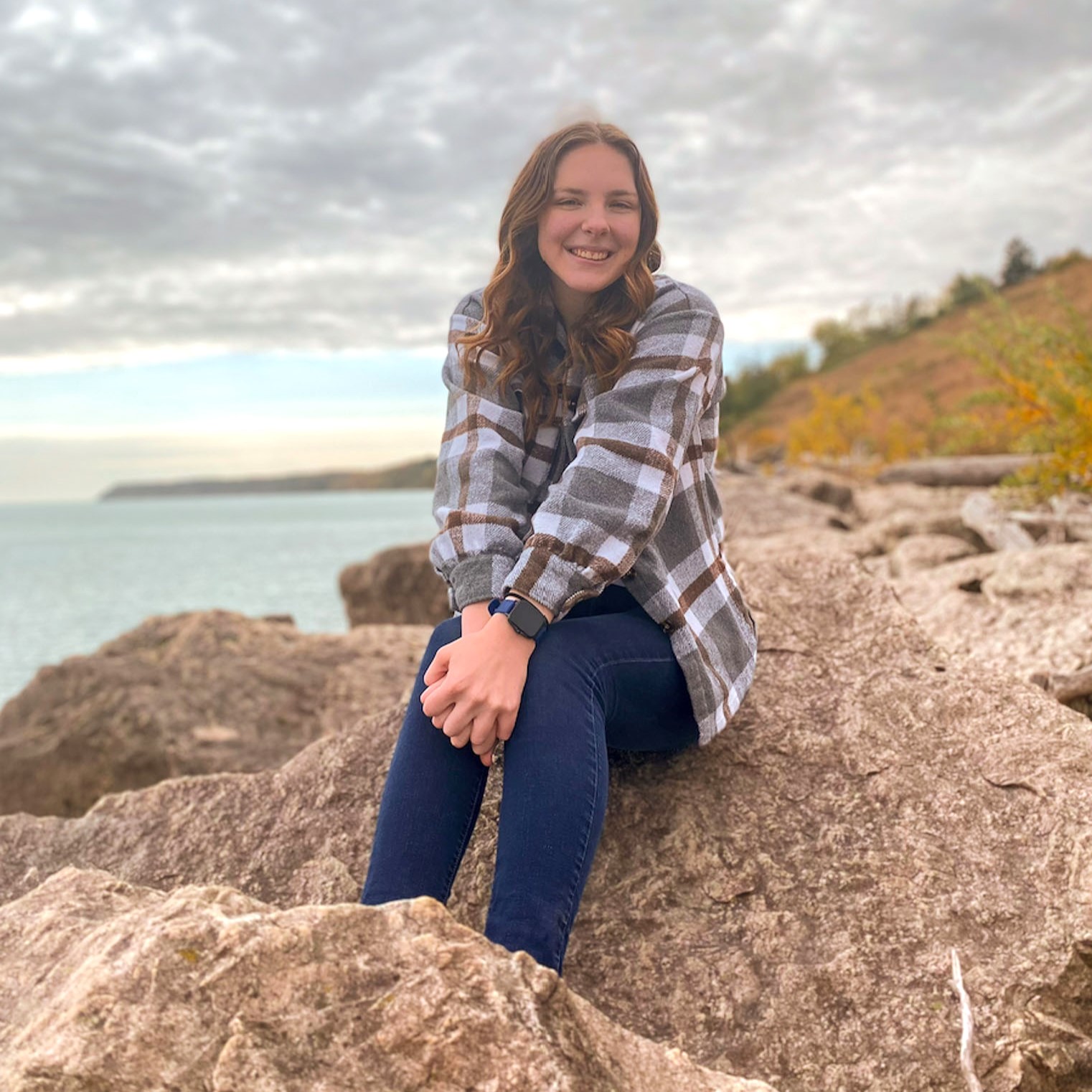 girl sitting on a rock