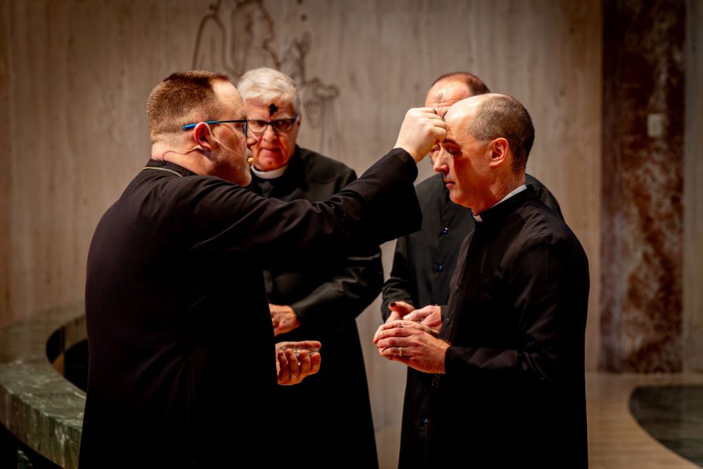 pastors huddled together