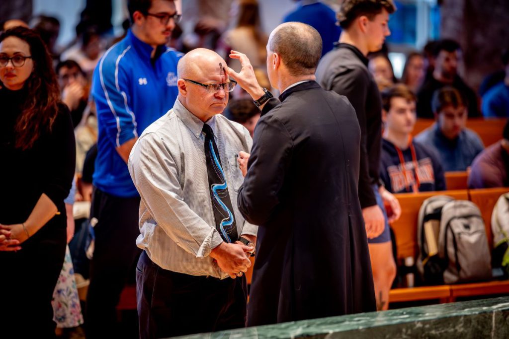 man receiving cross with ashes