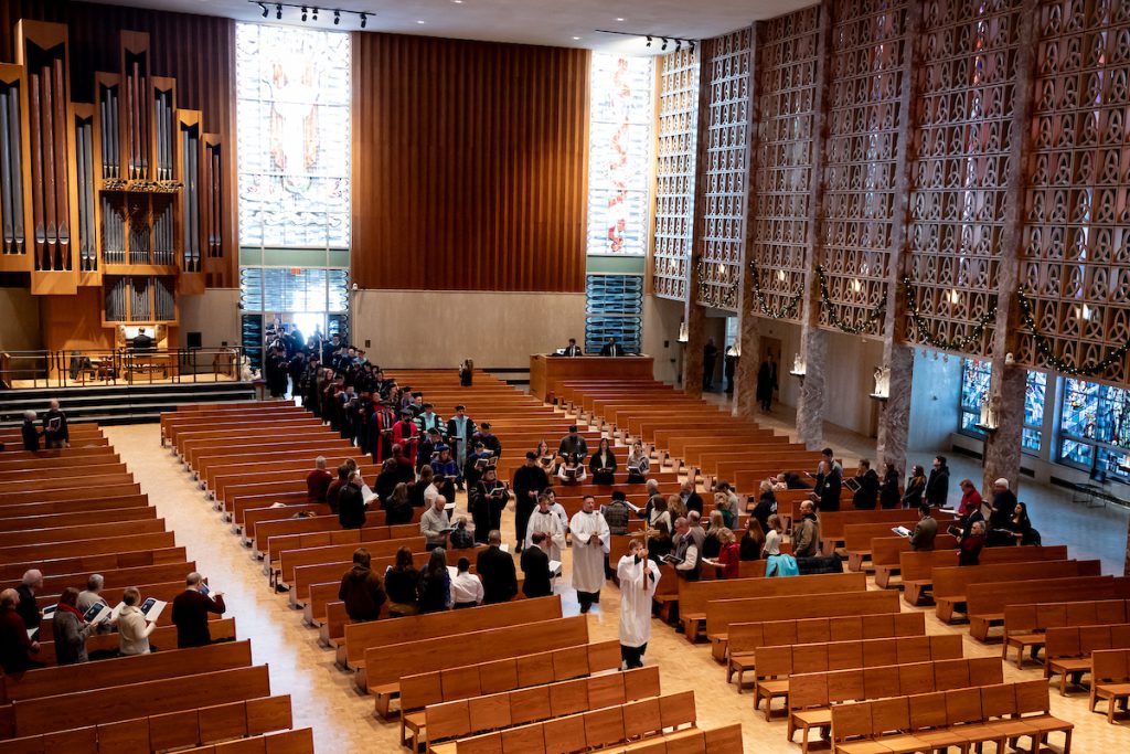 people walking in chapel ceremony