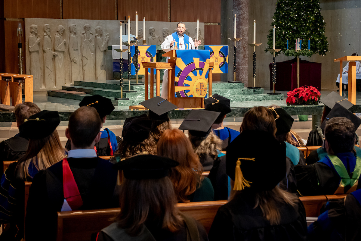 pastor speaking to graduates