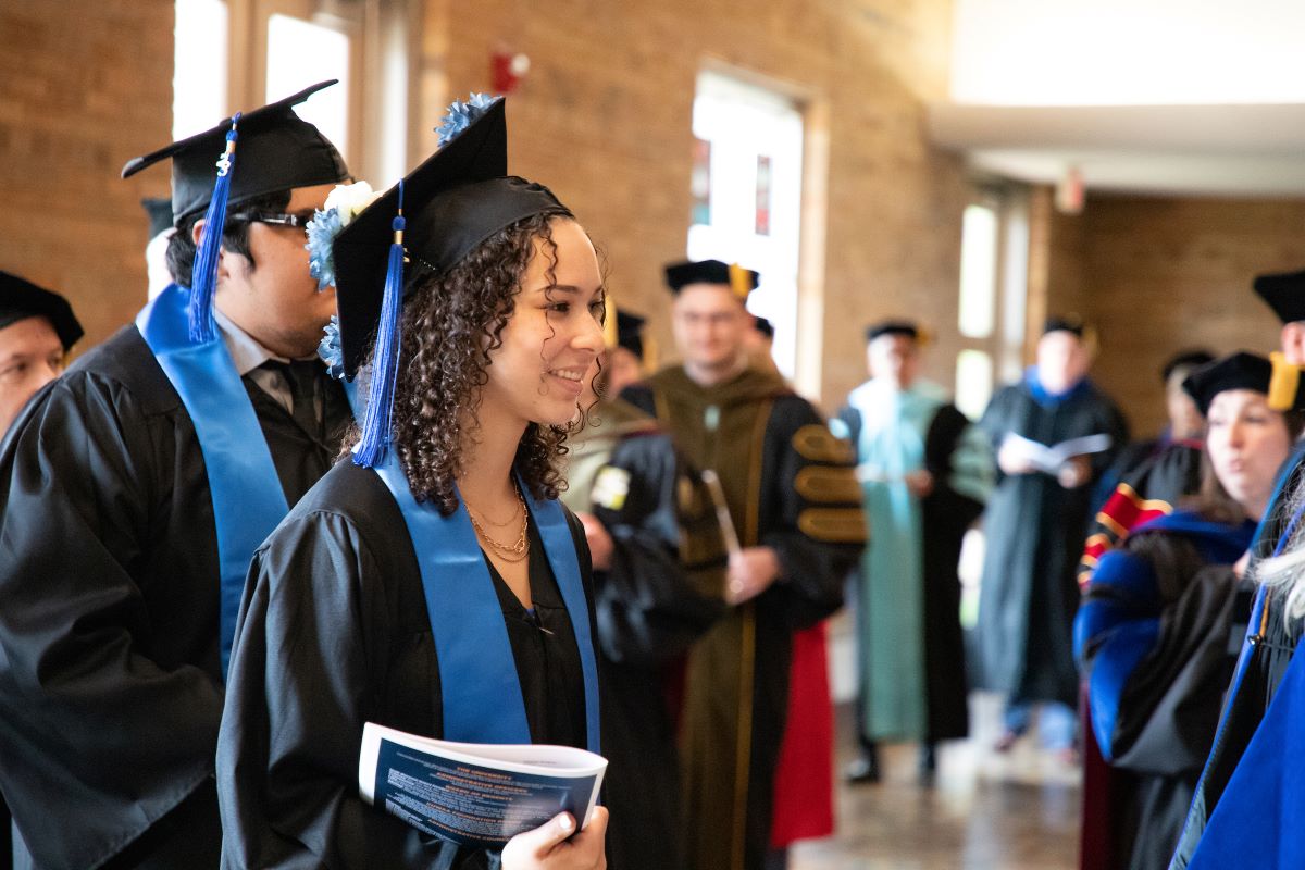 students ready for graduation outside of Chapel