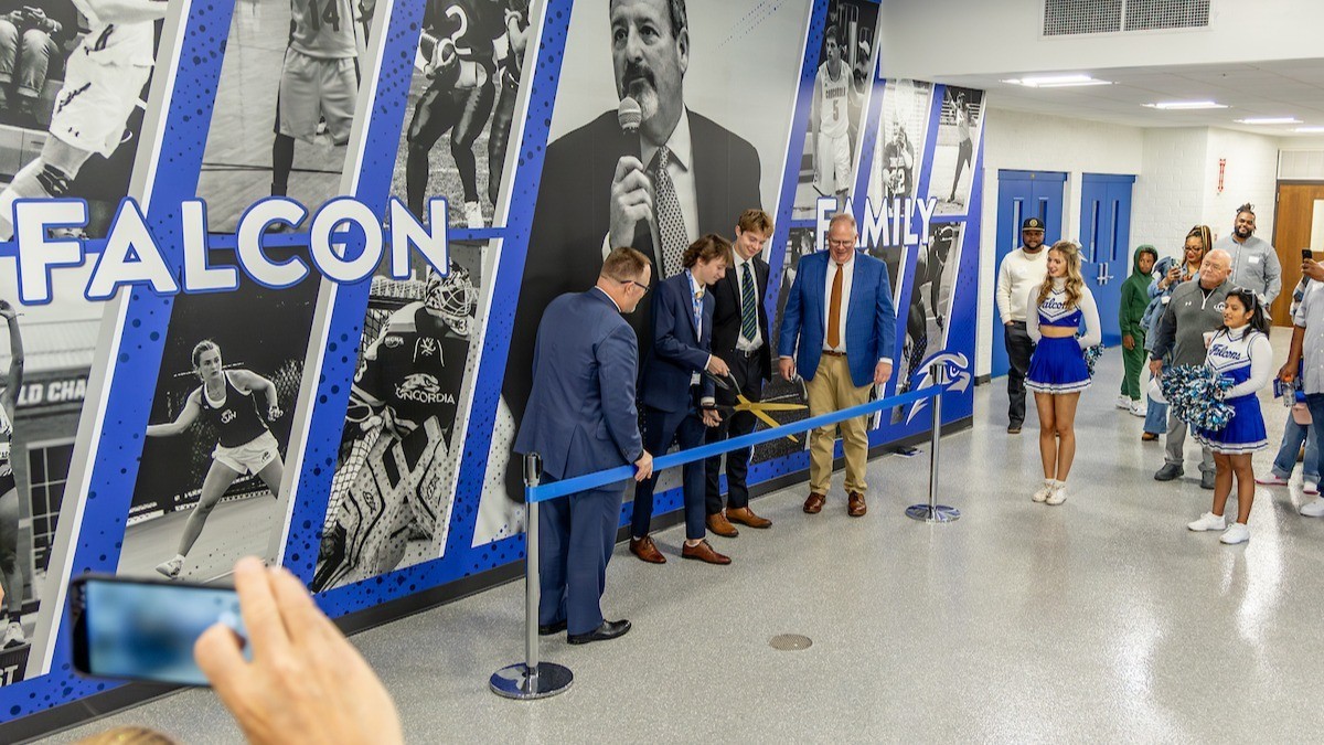Four men cutting ribbon