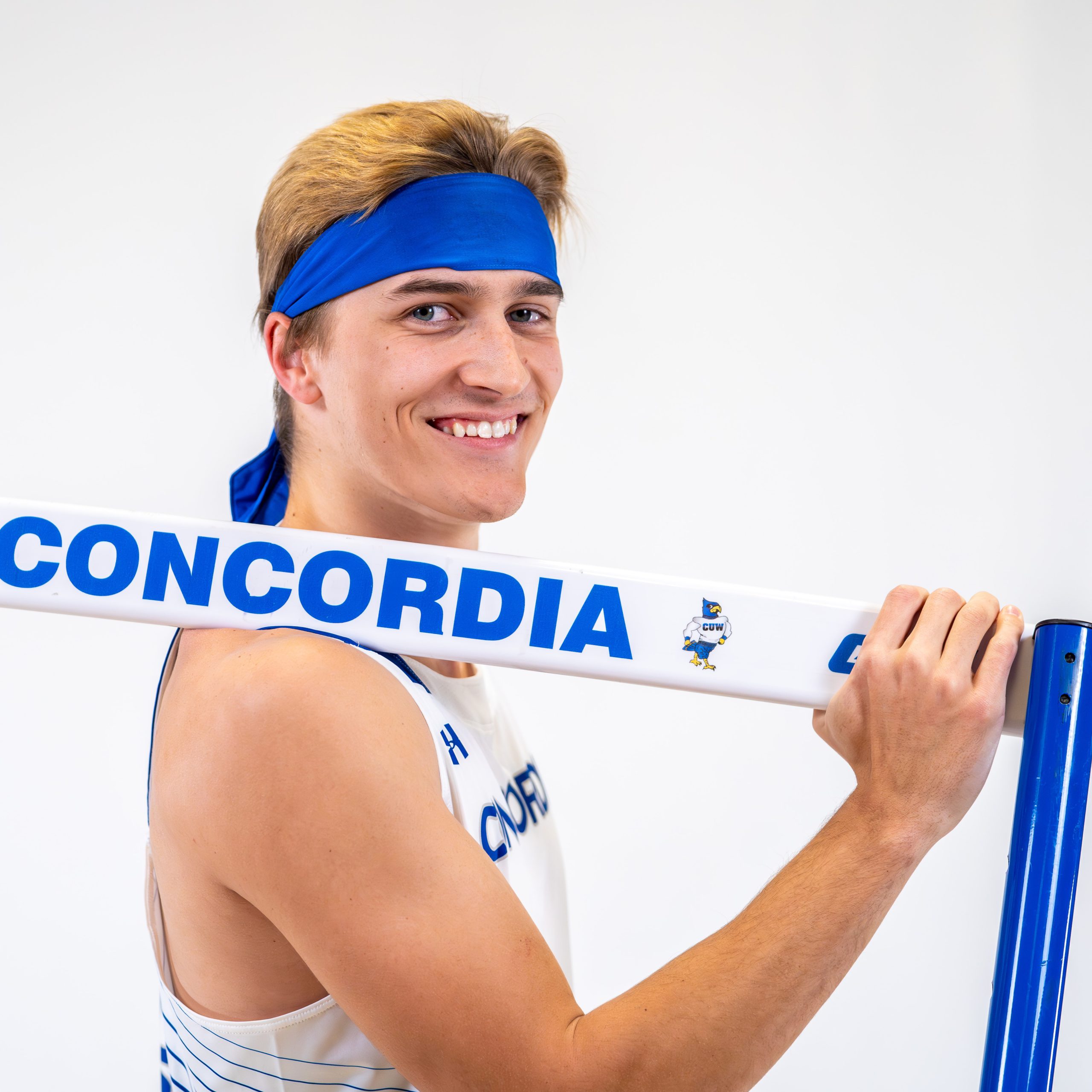 guy with blonde hair and blue sweatband