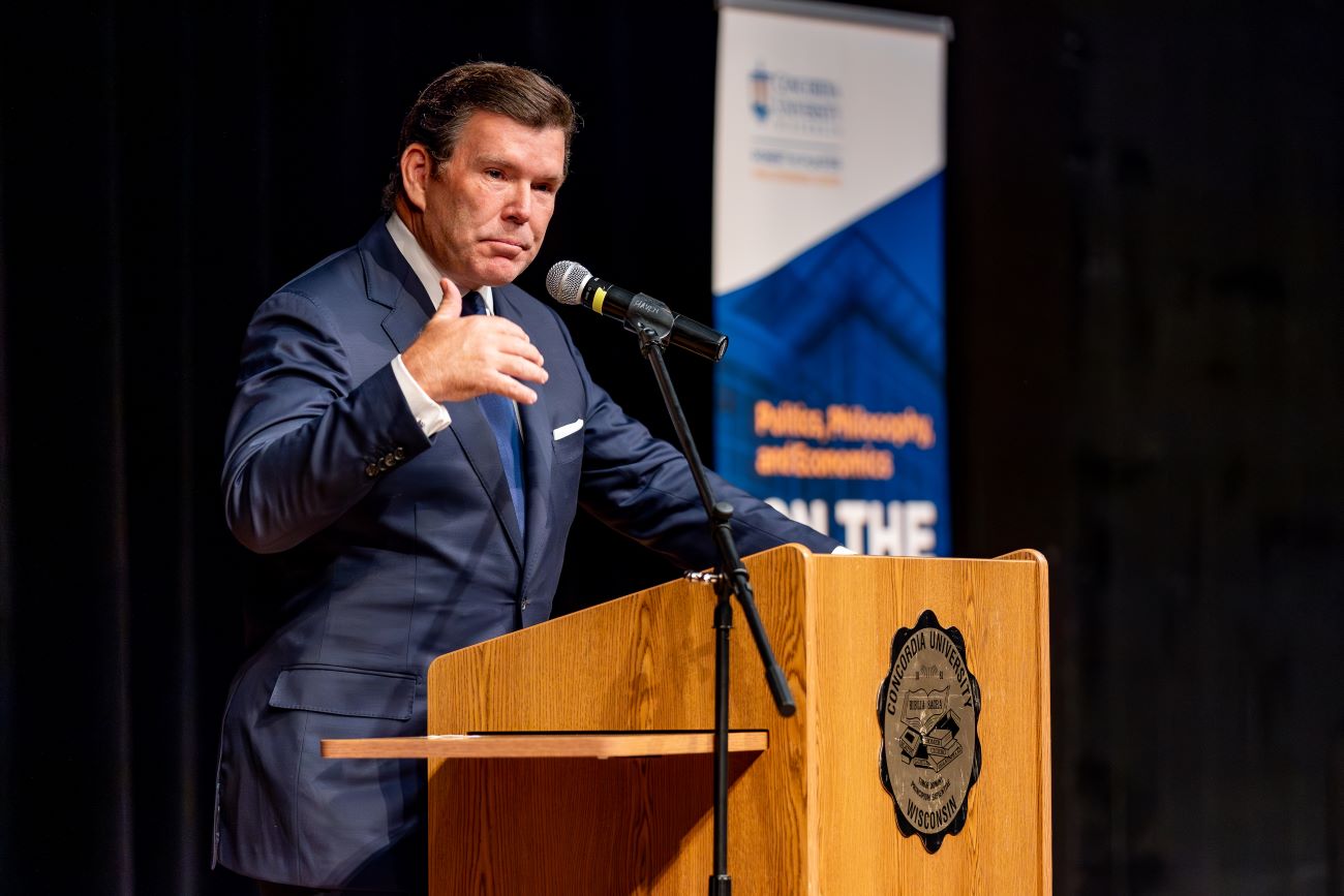 man talking at podium