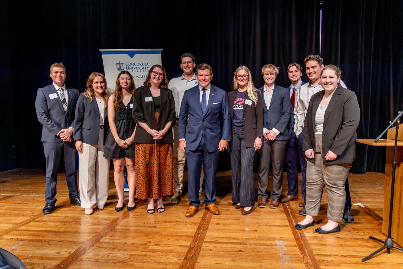 group together with news anchor in middle