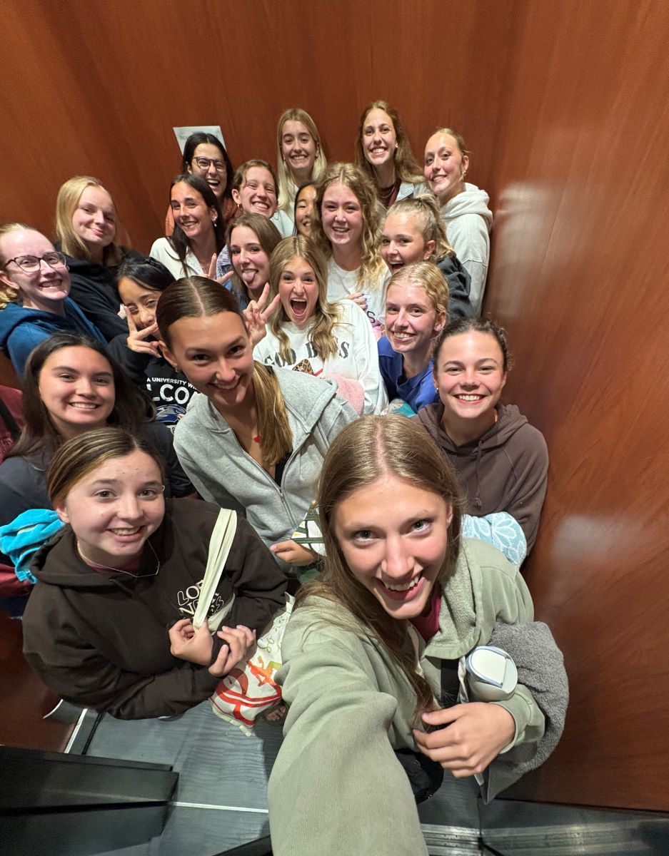 girls together in elevator