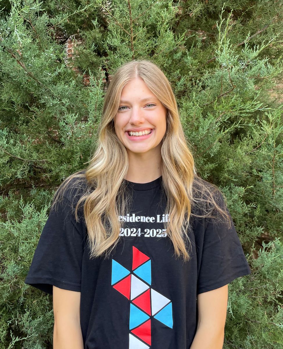 girl with blond hair and RA black shirt