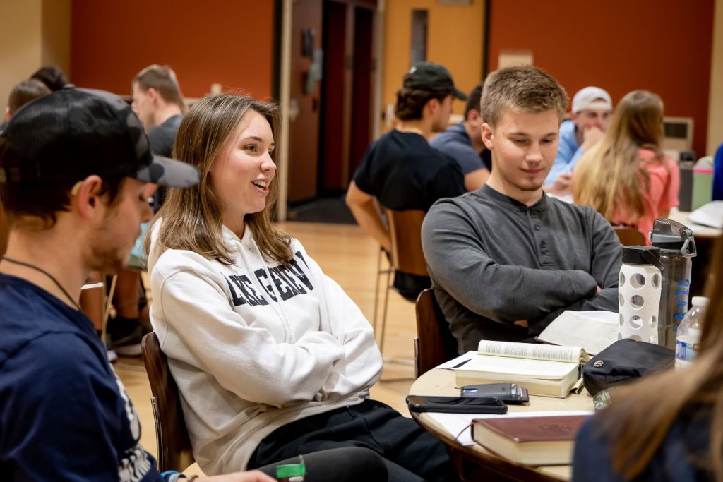 students discussing bible study and Scripture