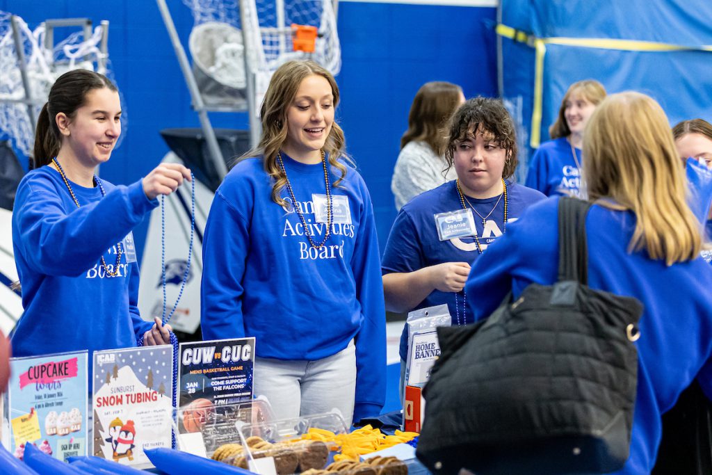 students selling stuff at game