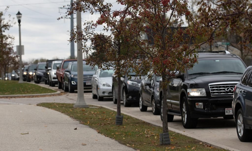Cars were lined up for miles outside of the Ozaukee County Transit Services building. 