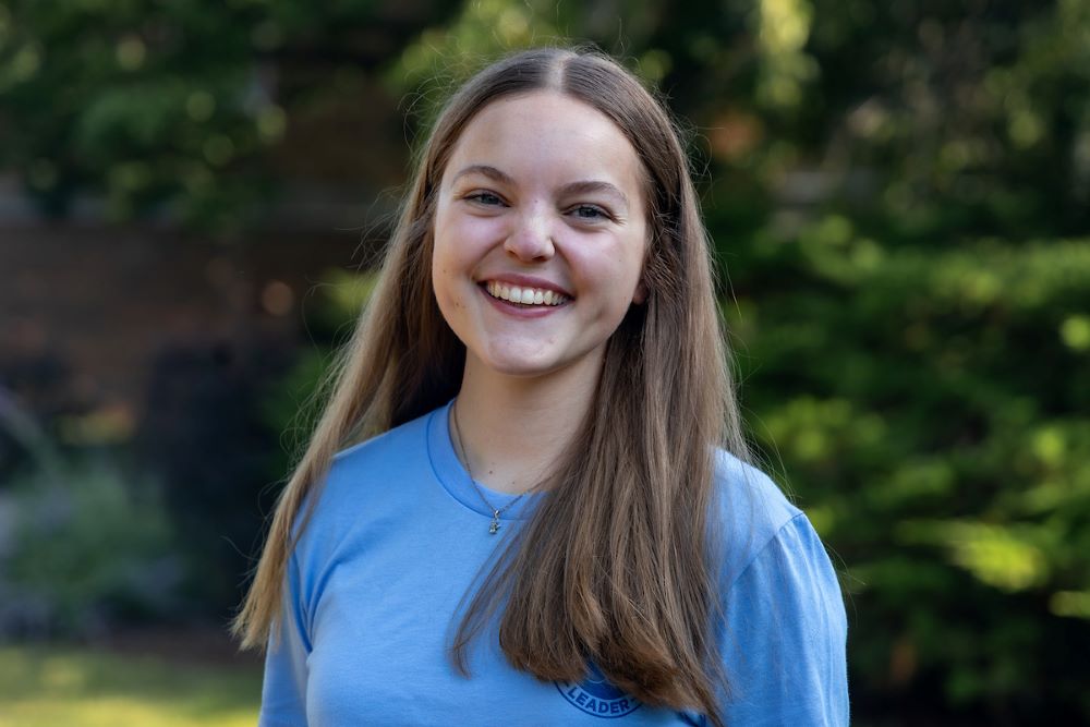 girl with long hair and blue shirt