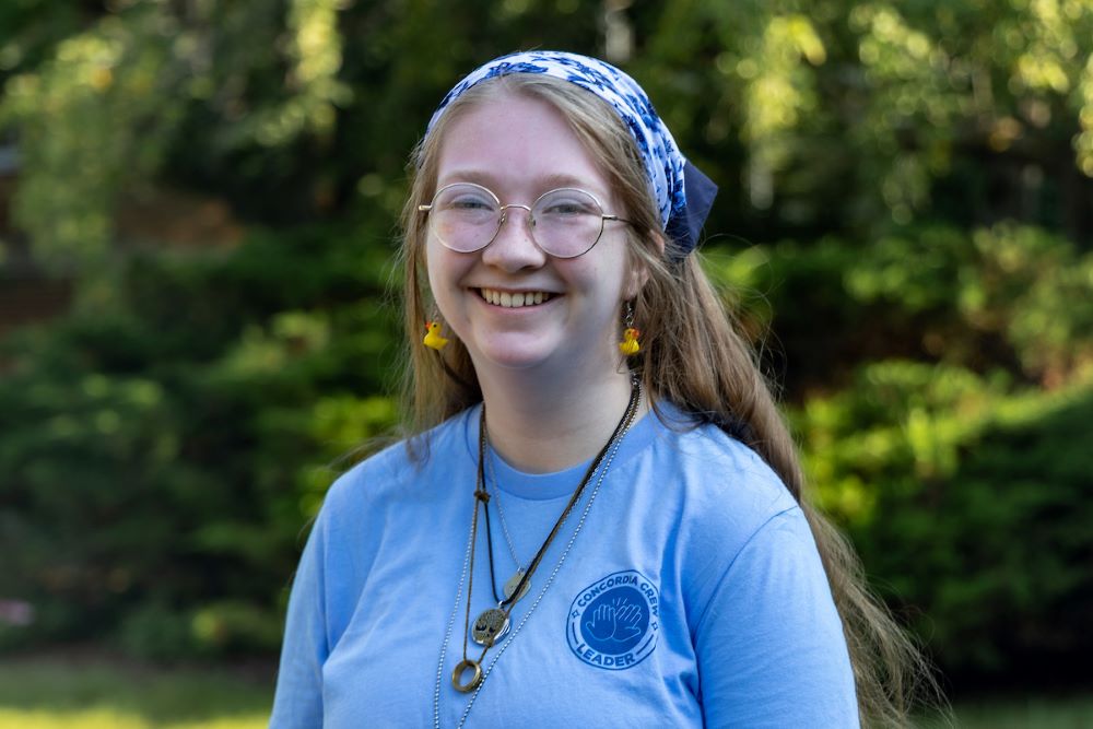 girl with long hair and glasses