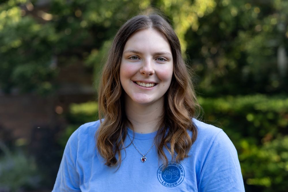girl with brown hair and blue shirt