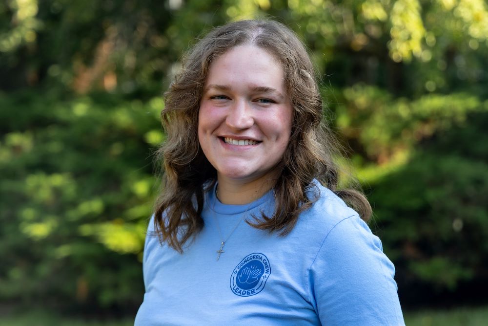 girl in blue shirt with brown hair