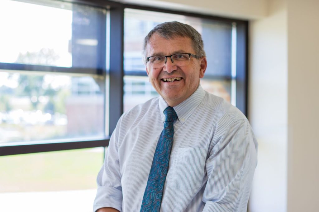 man with tie and glasses