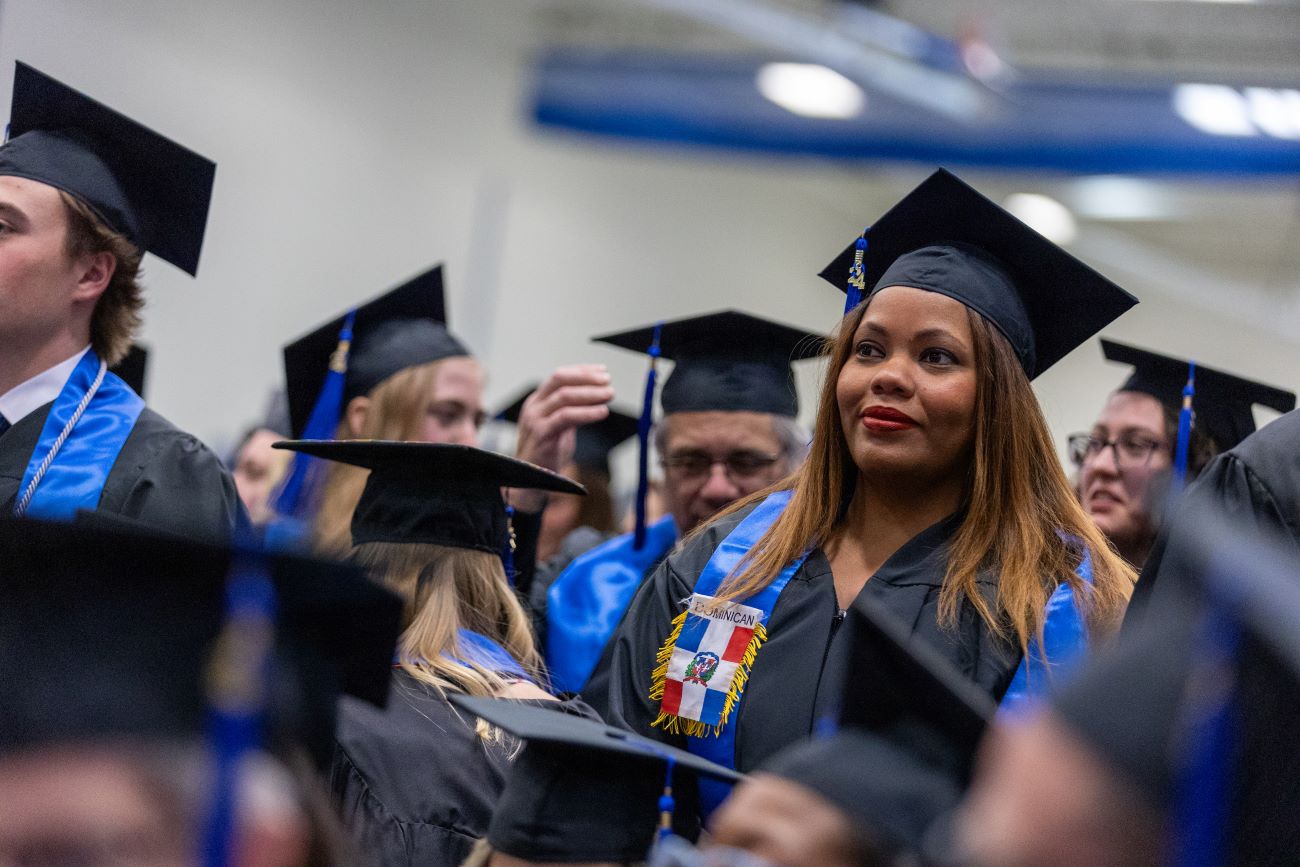 student looking with grad cap on head