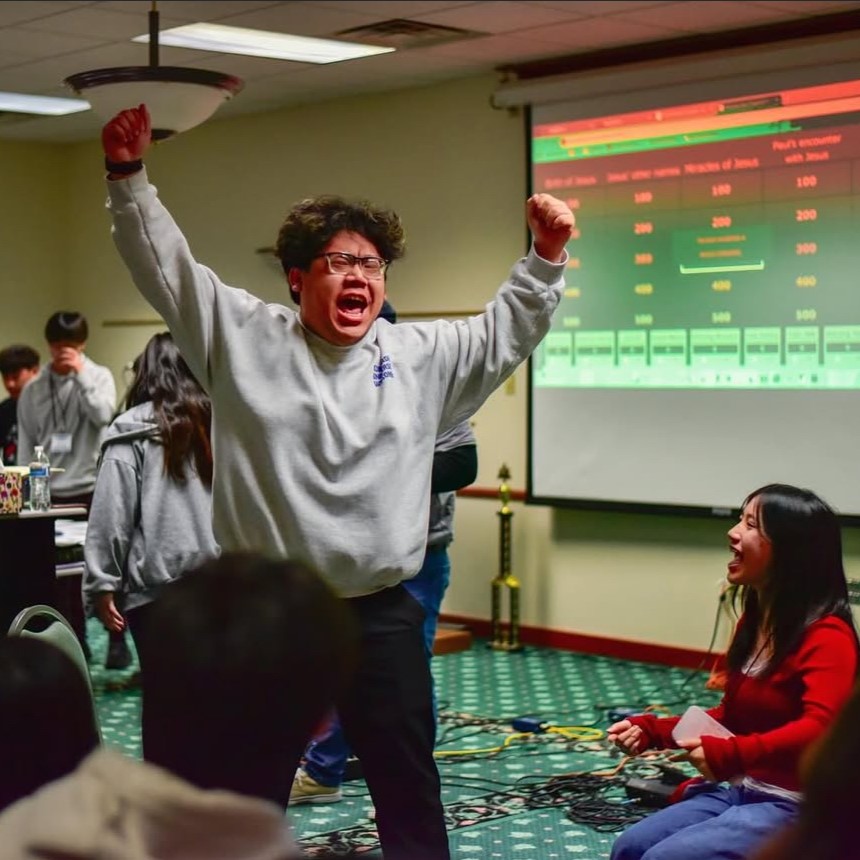 guy in sweatshirt cheering