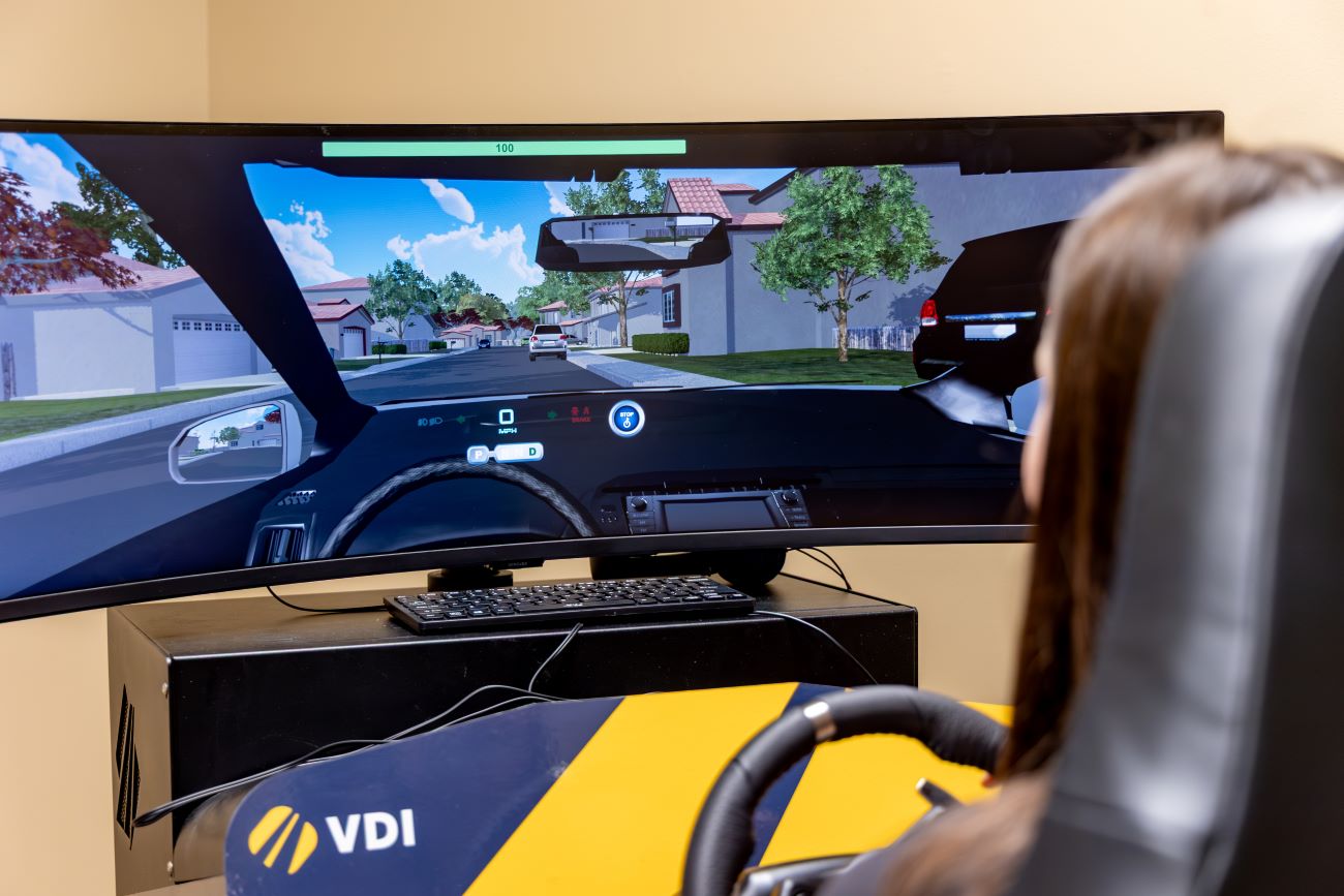 student using the driving simulator
