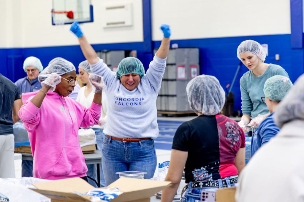 women excited and raising up arms