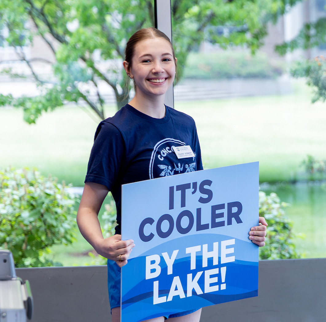student holding a sign