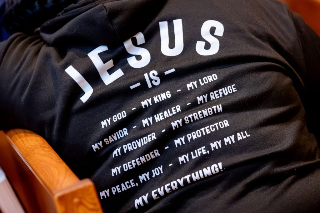 back of shirt with Jesus words on it