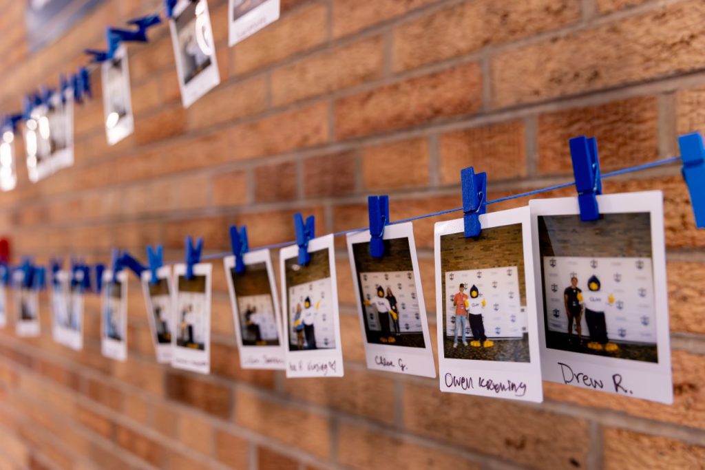 pictures of prospective students hanging up