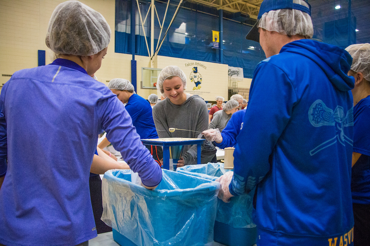 students volunteering for Feed My Starving Children event