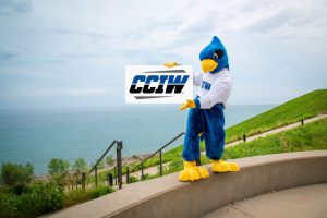 Freddy holding CCIW sign