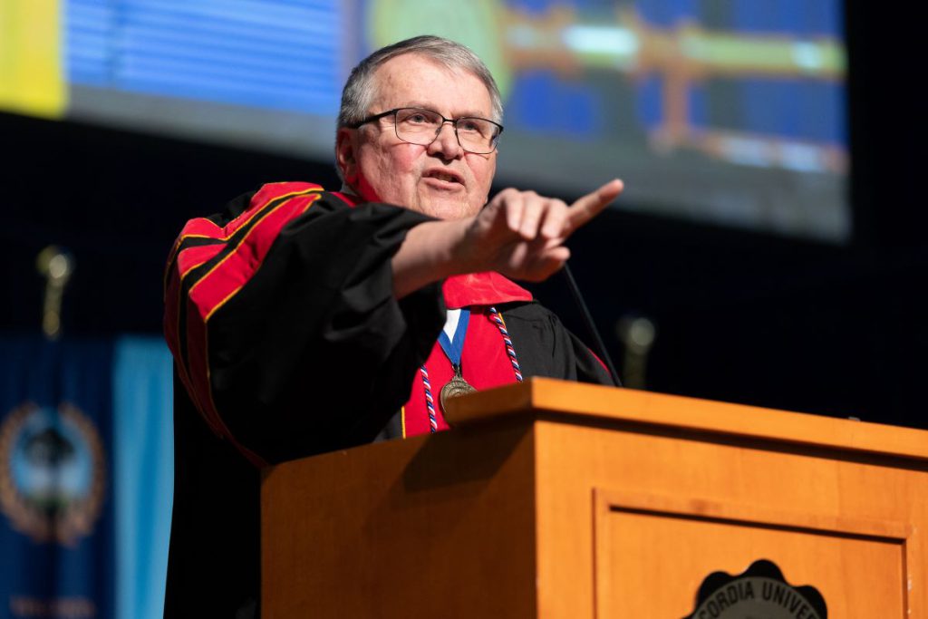 man with glasses at graduation