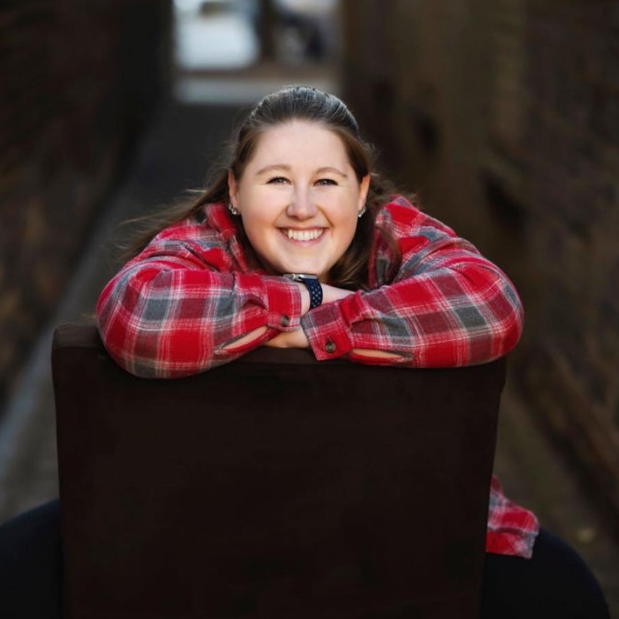 woman leaning over chair