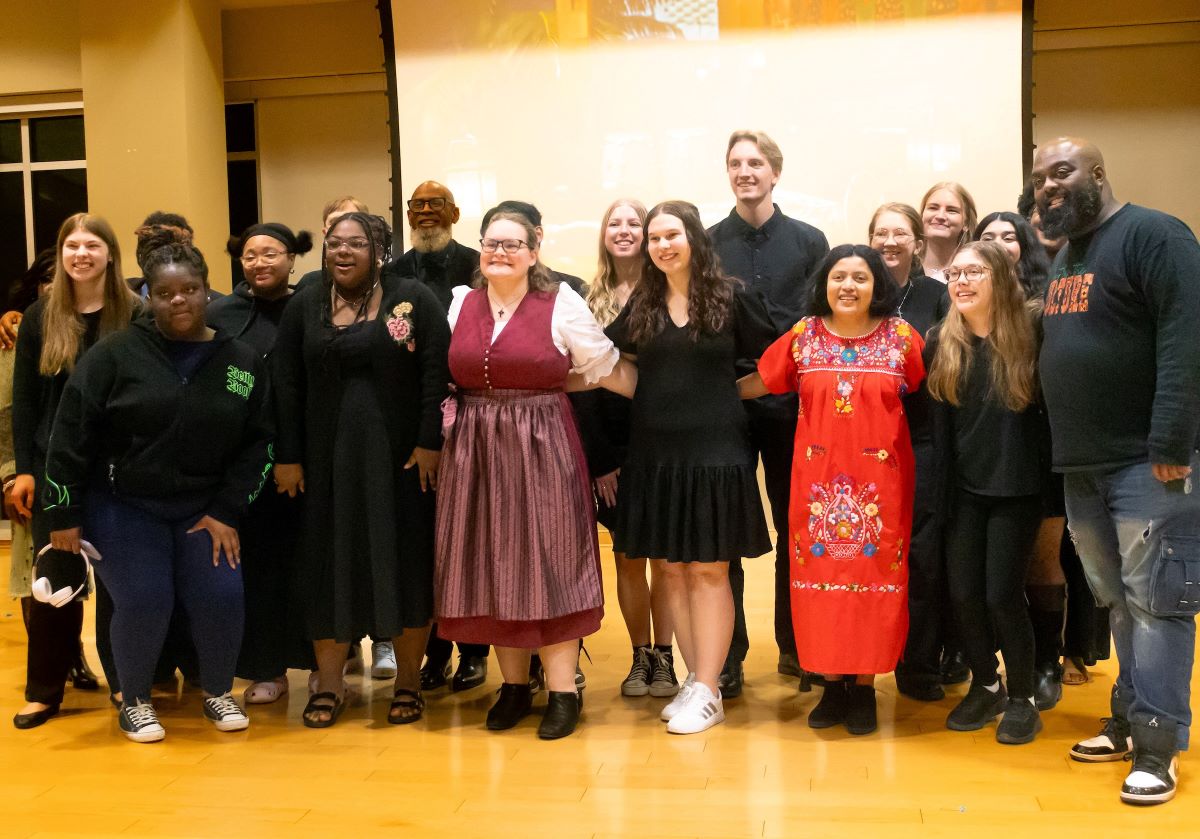 people of different ethnic backgrounds standing together