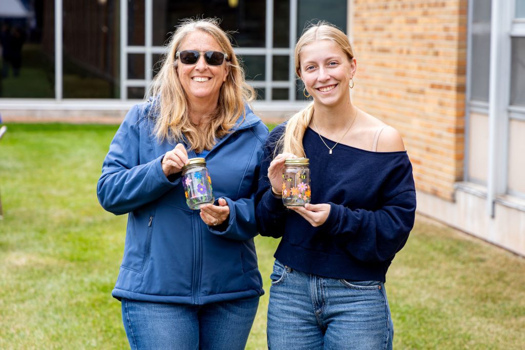 two women smiling at camera