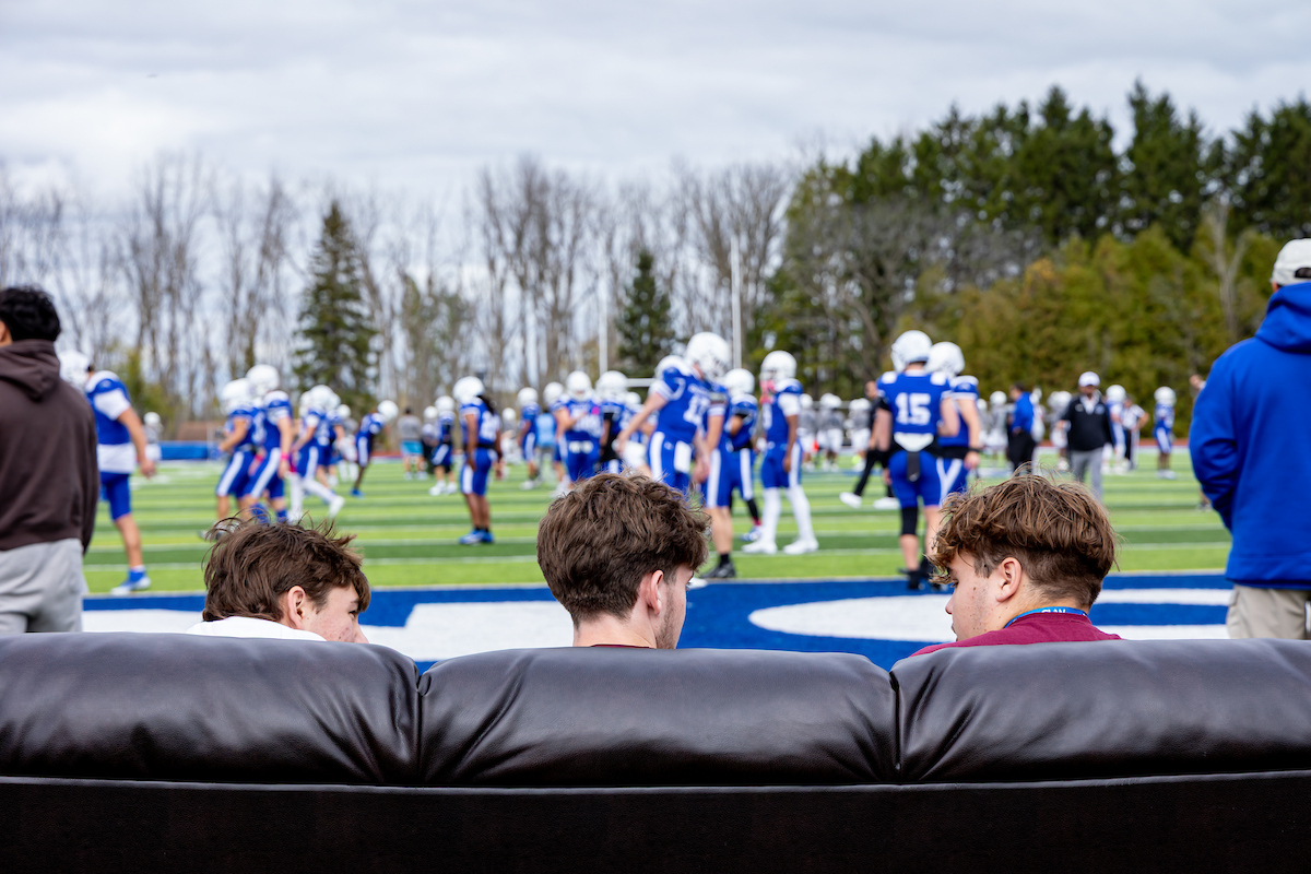 students at football game