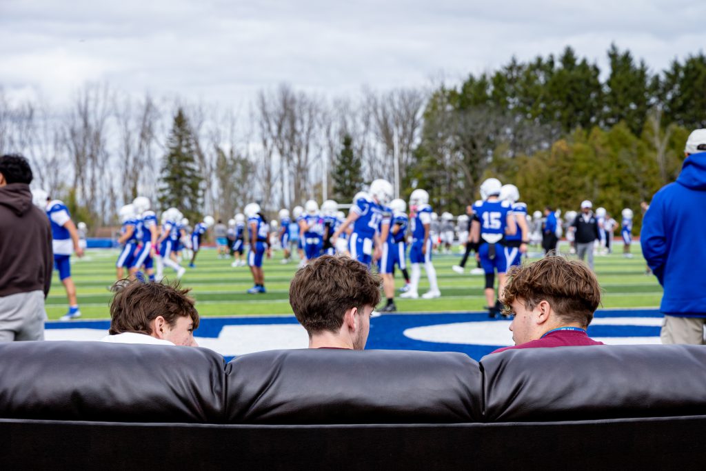 guys on couch watching football