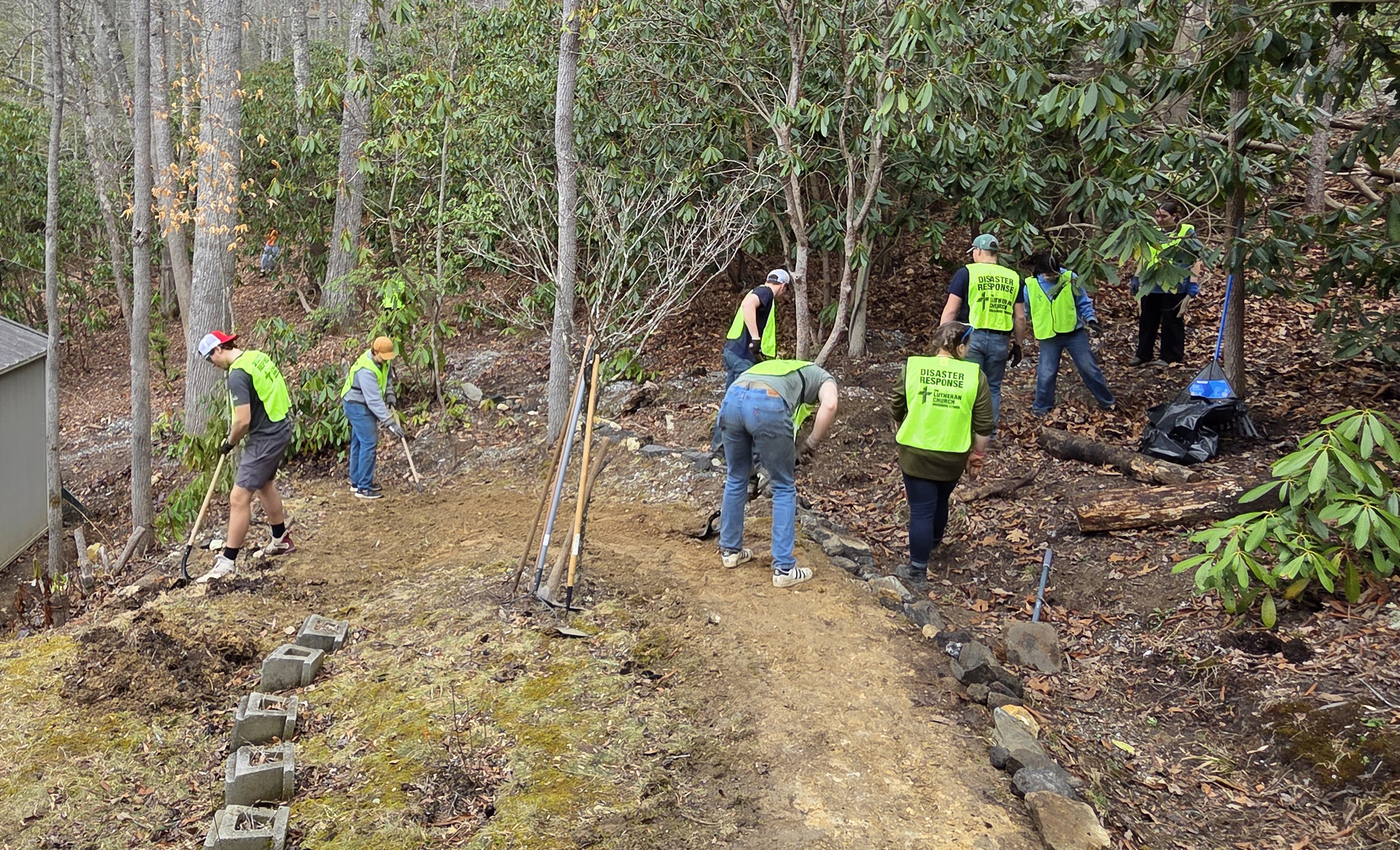 students in bright green vests