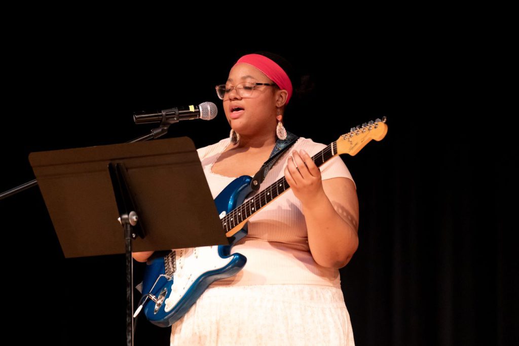 woman playing guitar