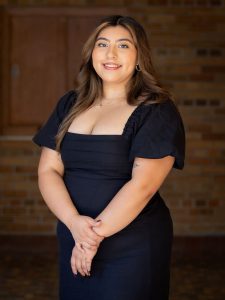 woman with brown hair in black dress