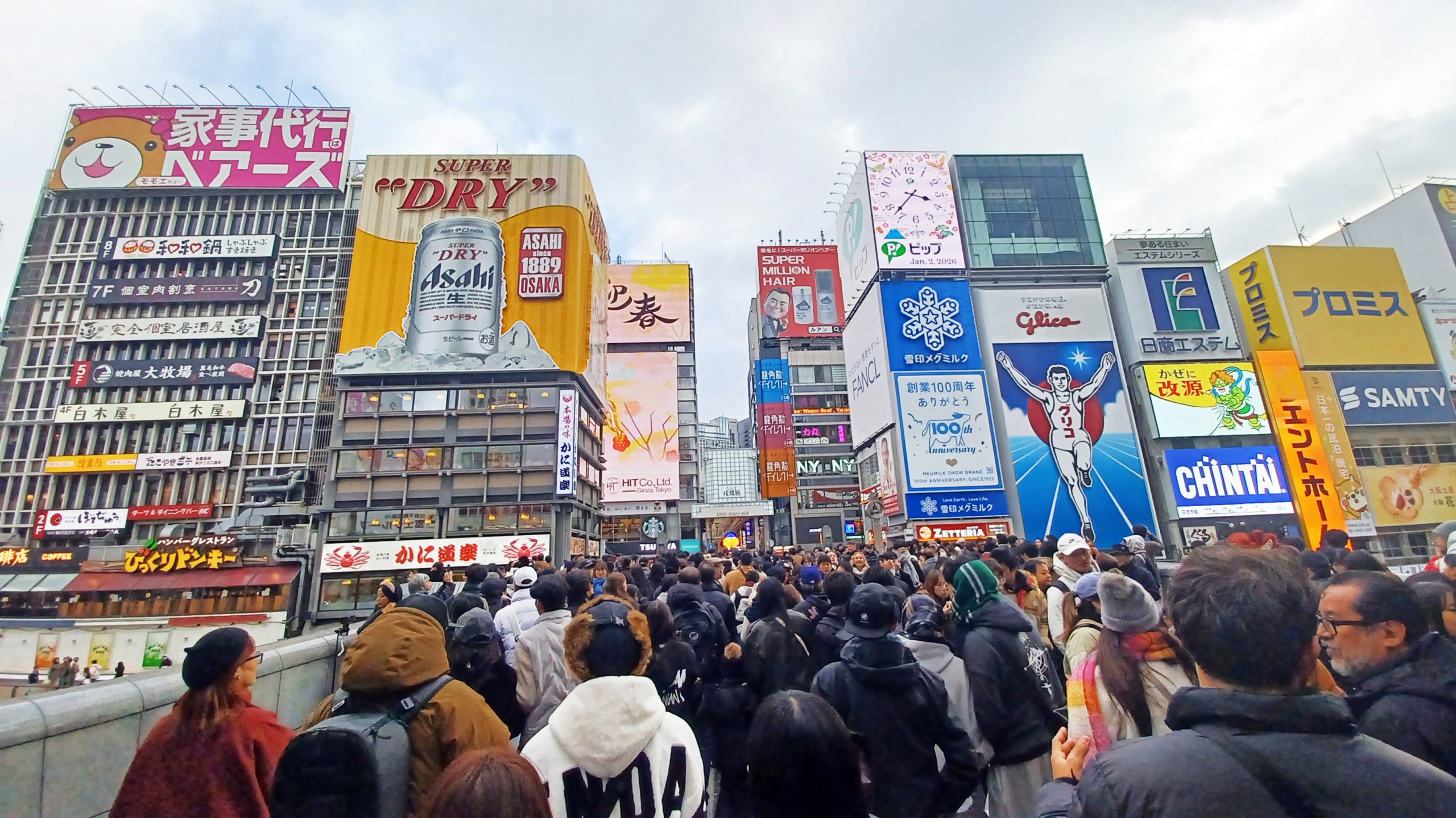 people in busy city with buildings in the background
