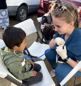 girl letting boy listen to her heart