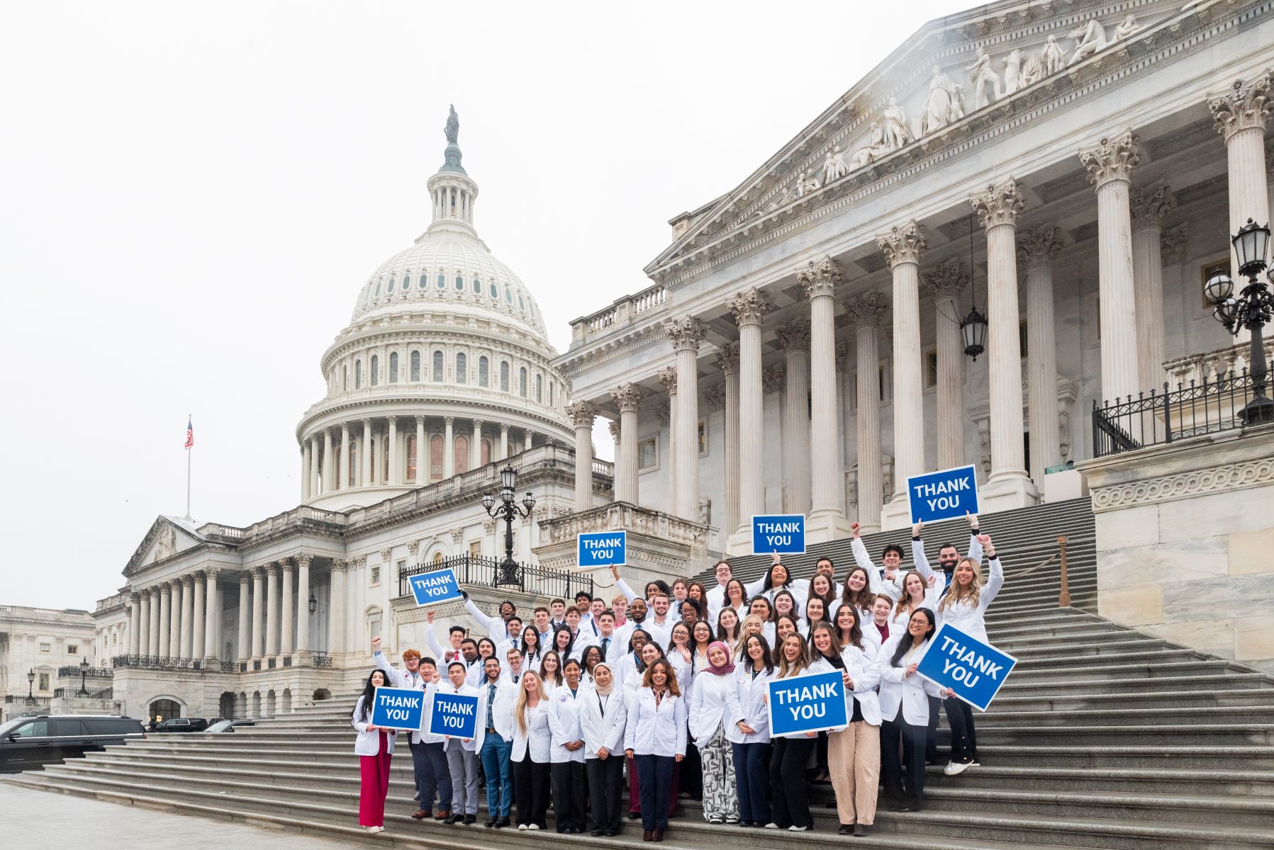pharmacy advocates holding signs in front of Capital