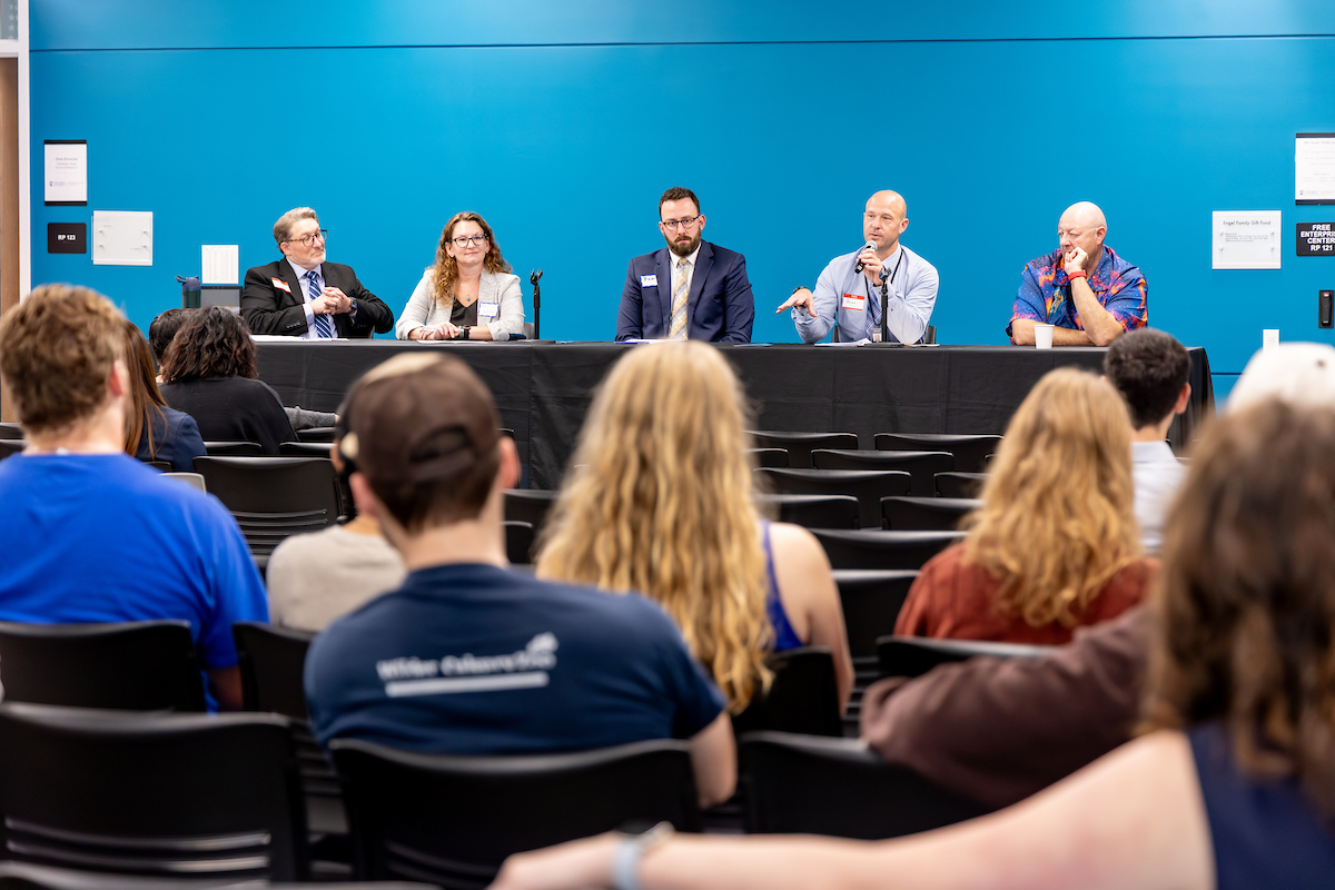 5 panelists at table