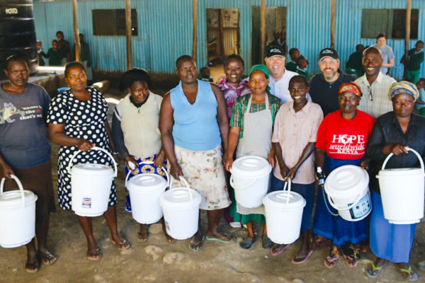 Families in the Mukuru slums in Kenya receive household water purifiers and training from Lance.