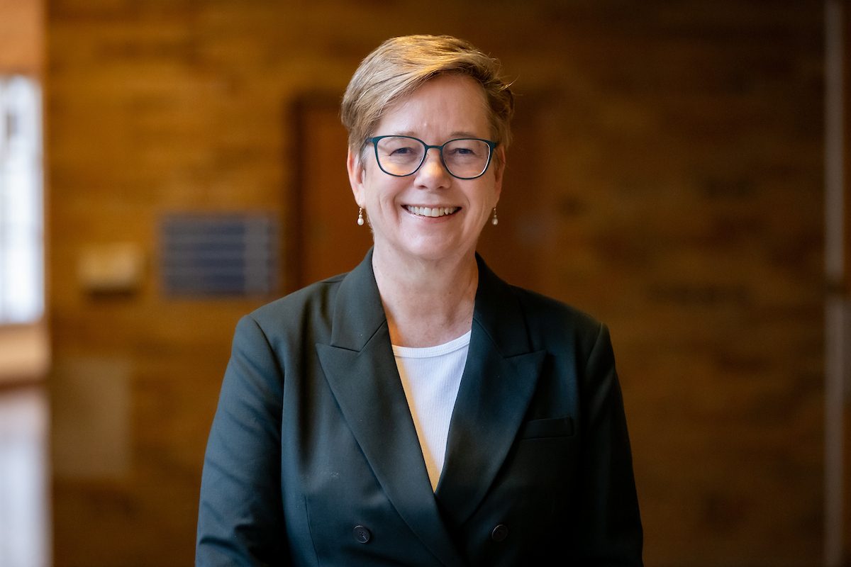 woman with glasses and jacket