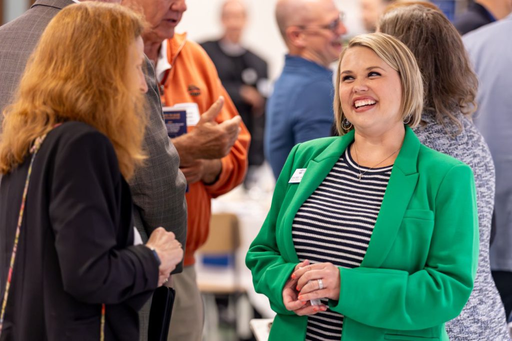 woman smiling in green