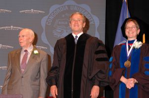woman with two men, one is President Bush