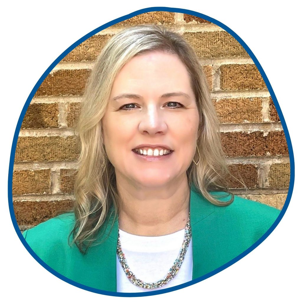 woman with blonde hair and green shirt