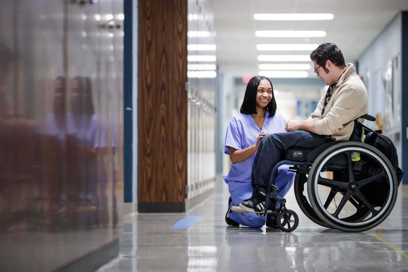 nurse by patient in wheelchair
