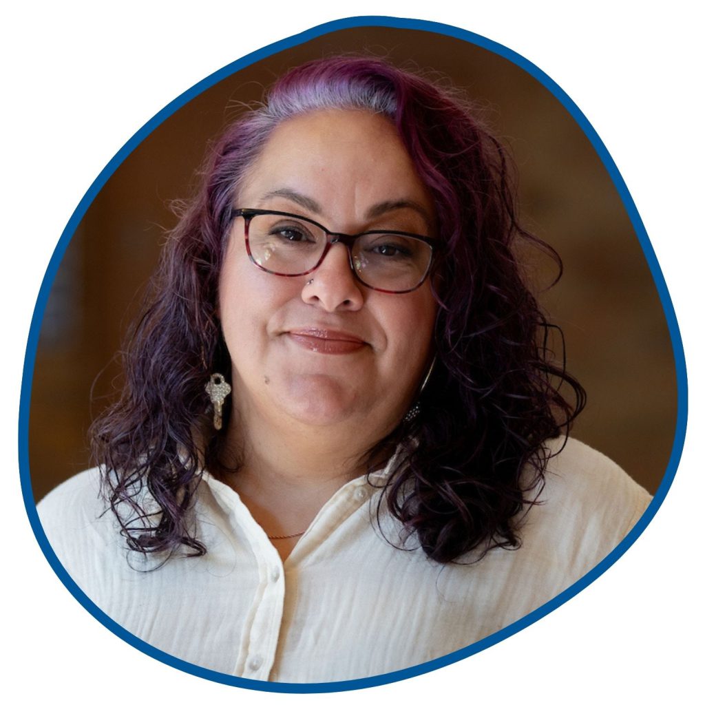 woman with purple hair and white outfit